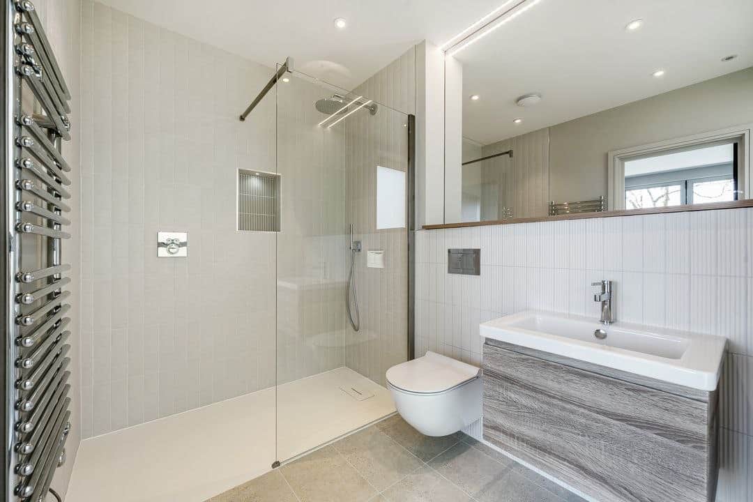 Clean premium bathroom finish in a managed coastal property