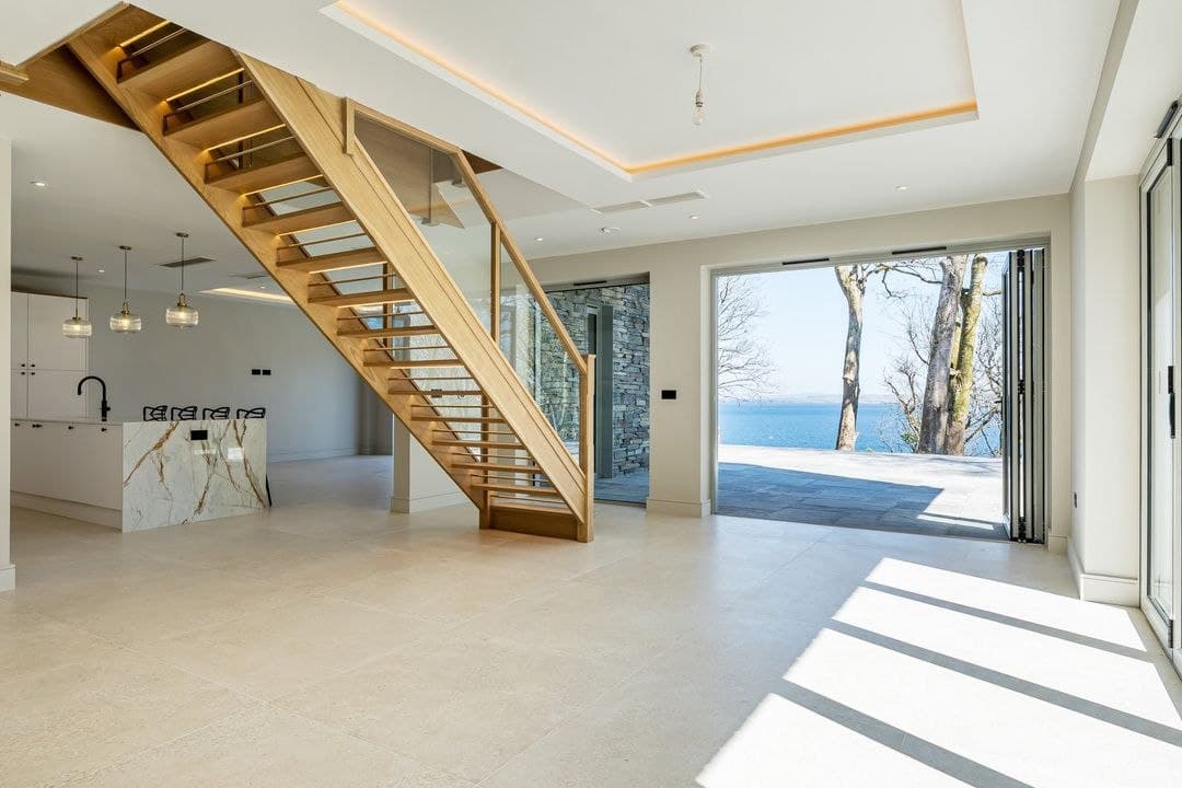 Under-stairs storage wall — completed bespoke storage work in Truro