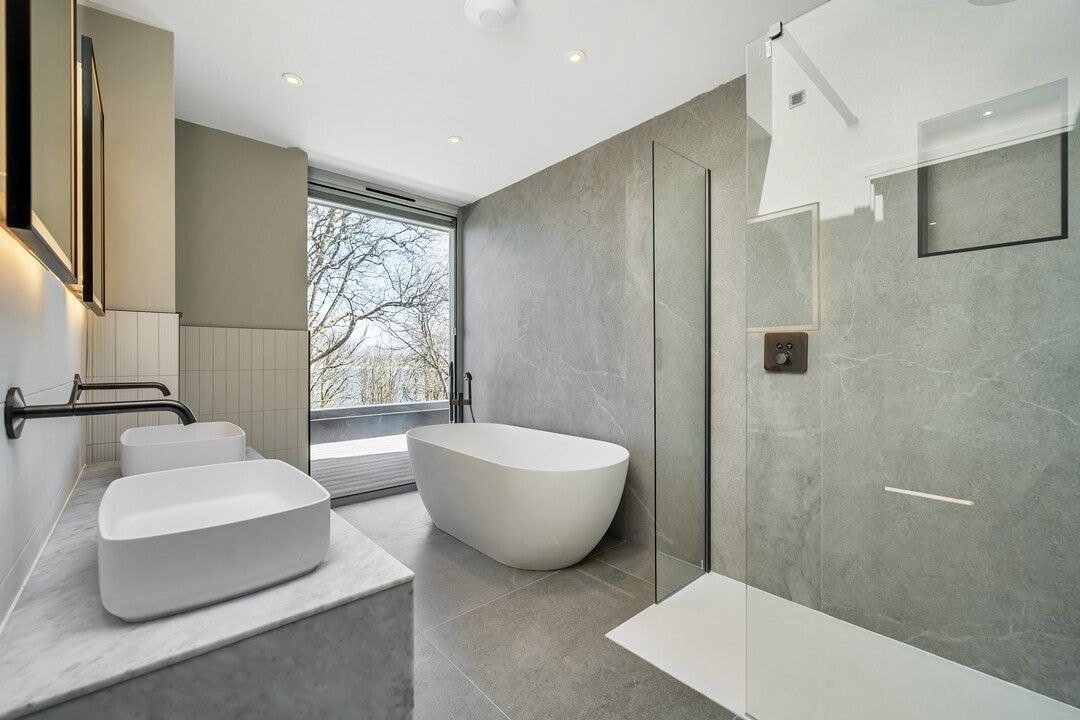 Luxury bathroom with freestanding bath and sea-facing view