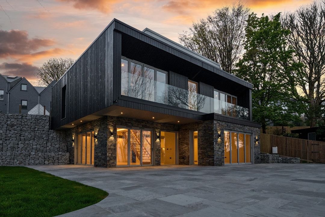 St Ives style coastal home with warm evening lighting